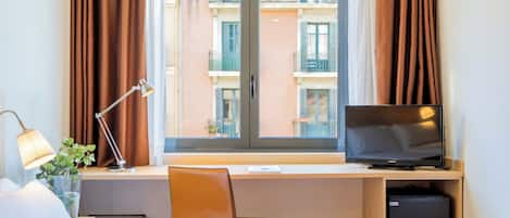 Superior Quadruple Room | Minibar, in-room safe, desk, laptop workspace