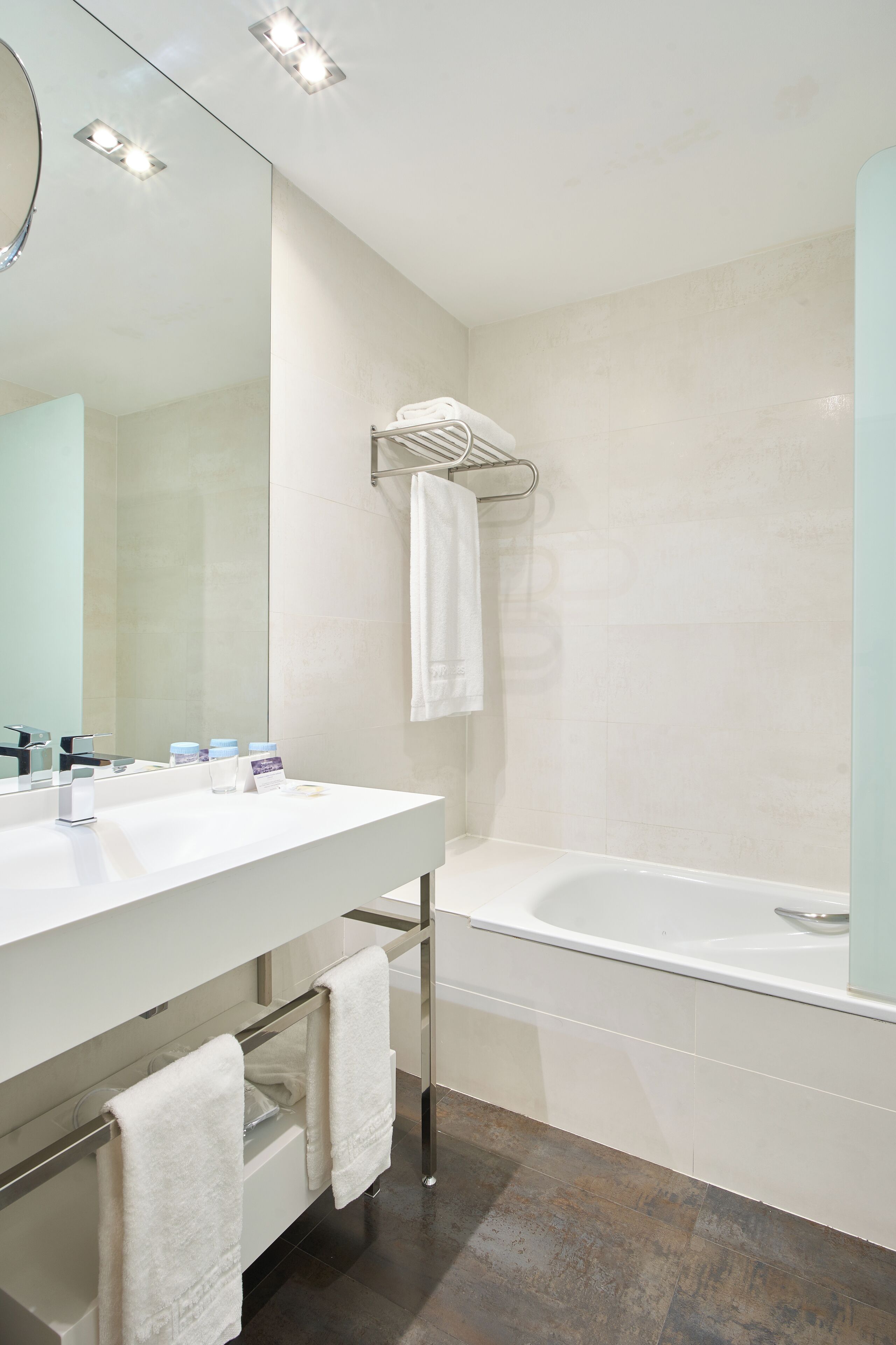 deep-soaking bathtub, designer toiletries, hair dryer, bidet