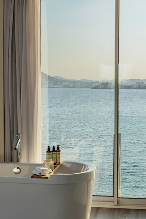 Designer toiletries, hair dryer, bathrobes, slippers