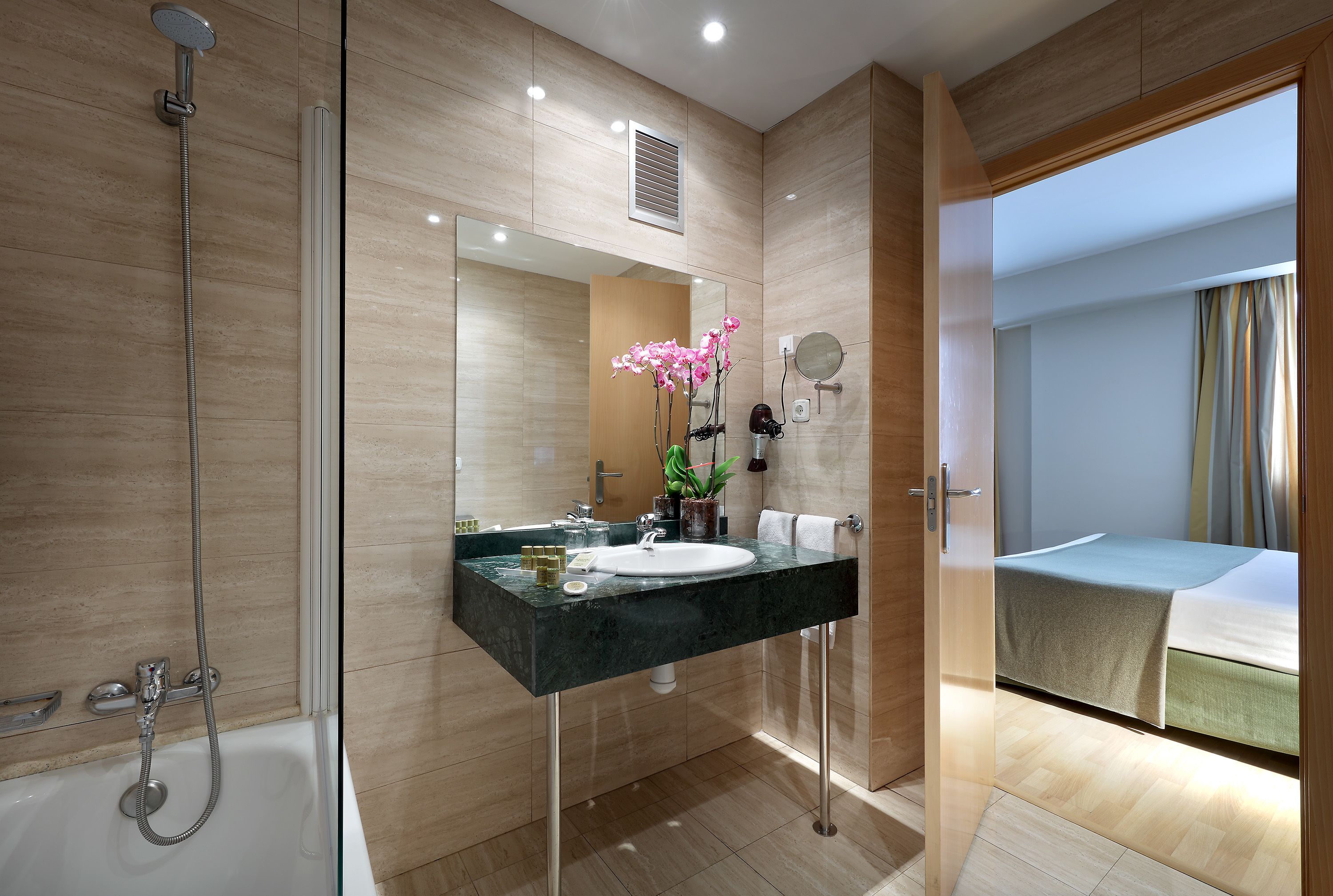 eco-friendly toiletries, hair dryer, slippers, bidet