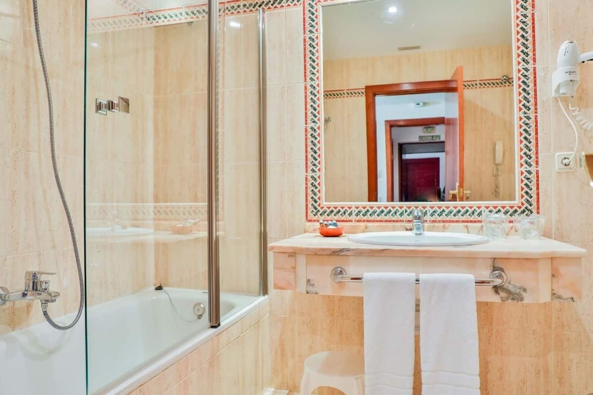 shower, hair dryer, bidet, towels