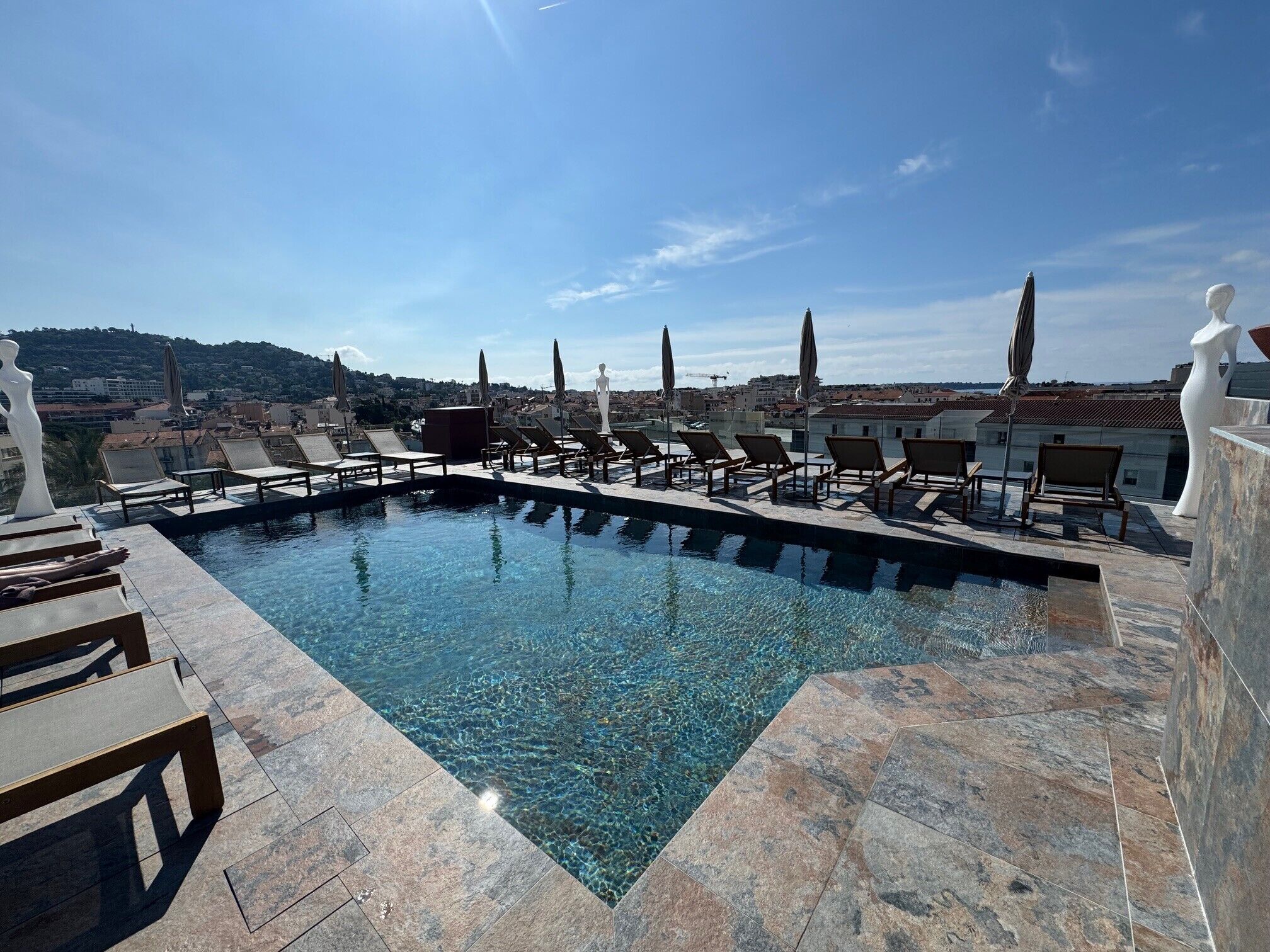 seasonal outdoor pool, open 10:00 am to 9:30 pm, pool umbrellas