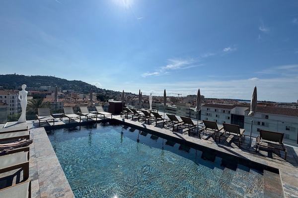 Seasonal outdoor pool, open 10:00 AM to 9:30 PM, pool umbrellas