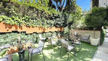 Relax in comfort amidst lush greenery and modern seating.