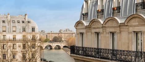 A historic building with classical architecture, featuring arched windows and a prominent dome.