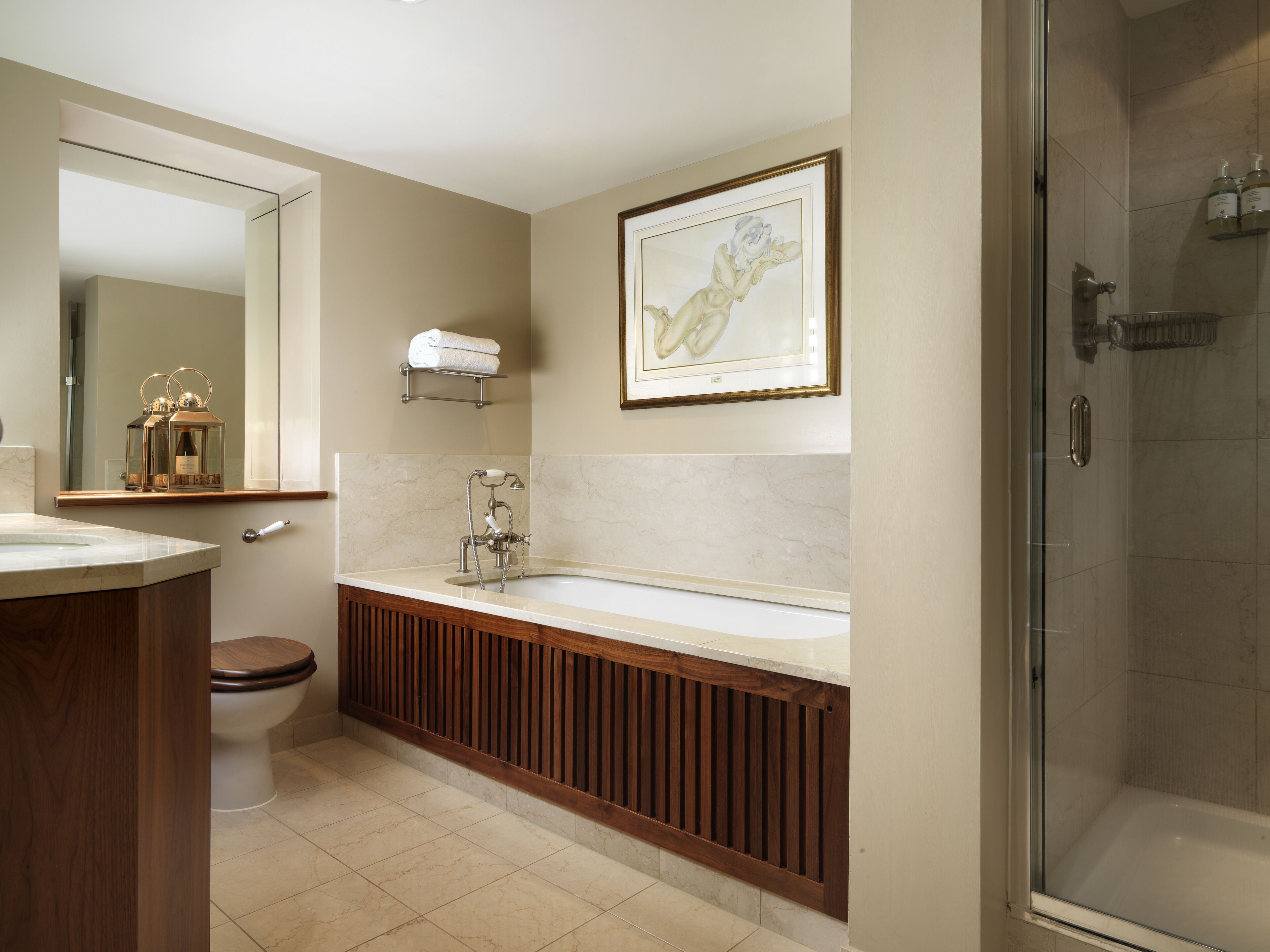 atrium suite | bathroom | combined shower/bathtub, designer toiletries, hair dryer, bathrobes