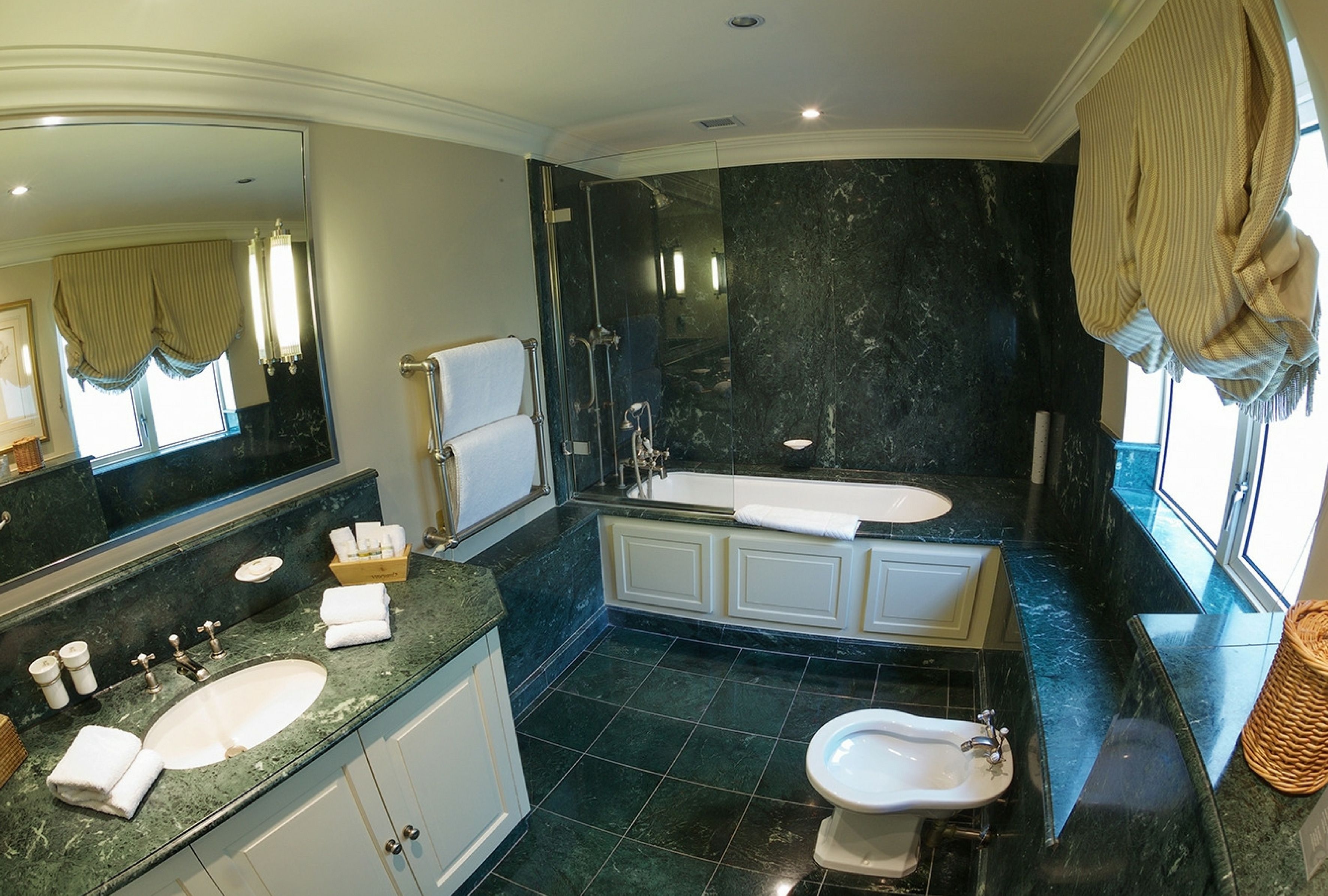 luxury double room | bathroom | combined shower/bathtub, designer toiletries, hair dryer, bathrobes