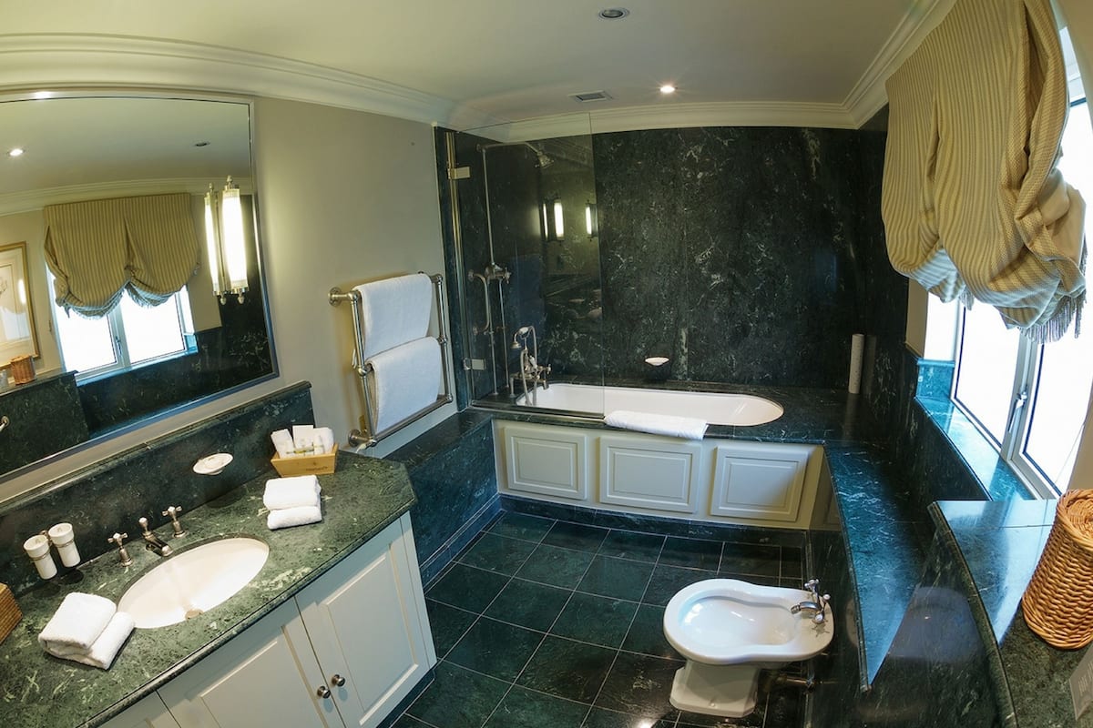 luxury double room | bathroom | combined shower/bathtub, designer toiletries, hair dryer, bathrobes