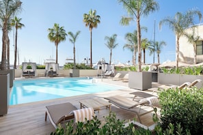 Seasonal outdoor pool, pool umbrellas, pool loungers