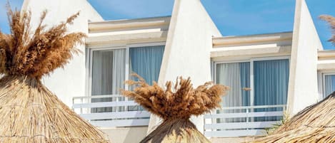 Seasonal outdoor pool, open 9:00 AM to 9:00 PM, pool umbrellas