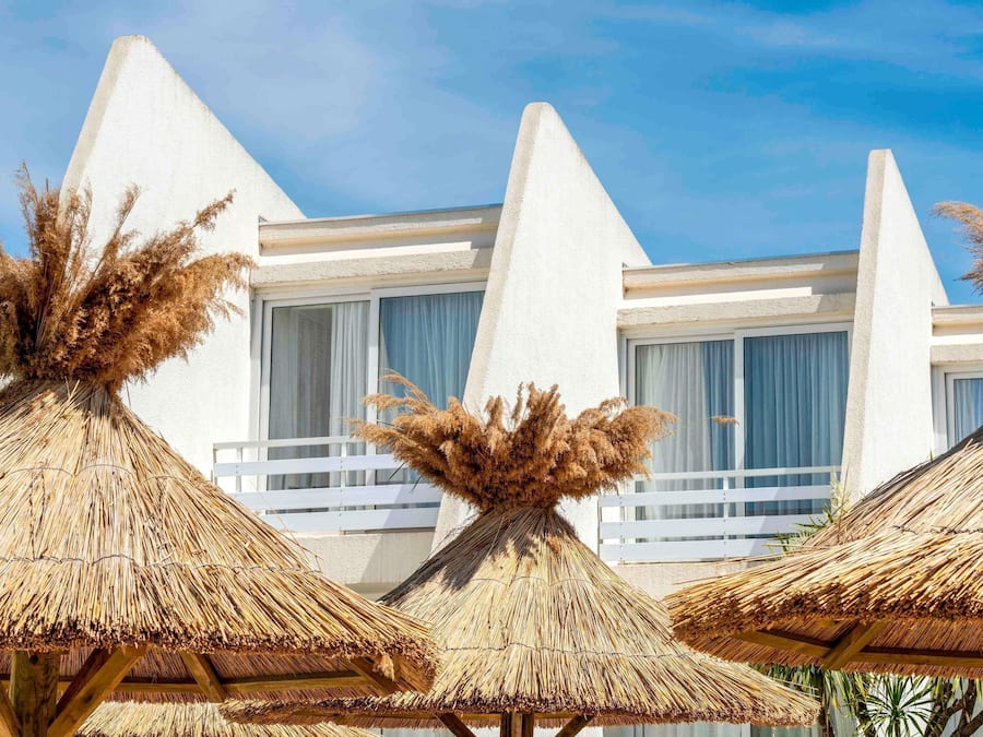 Seasonal outdoor pool, open 9:00 AM to 9:00 PM, pool umbrellas