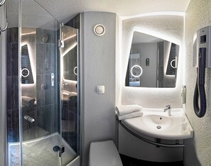 Eco-friendly toiletries, hair dryer, towels