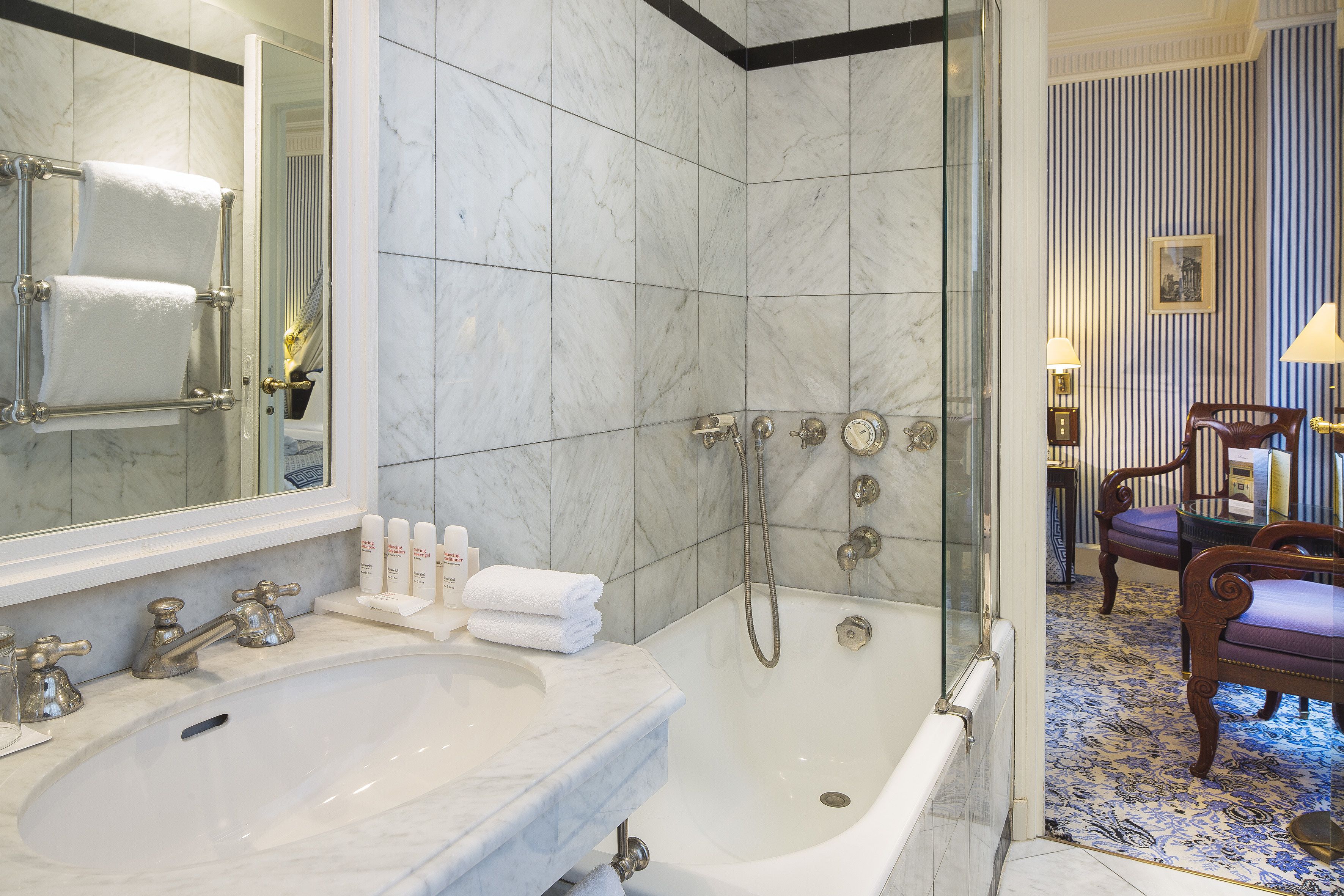 designer toiletries, hair dryer, bathrobes, slippers