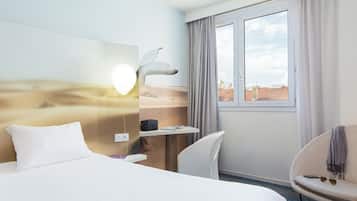 Premium bedding, pillow-top beds, desk, laptop workspace