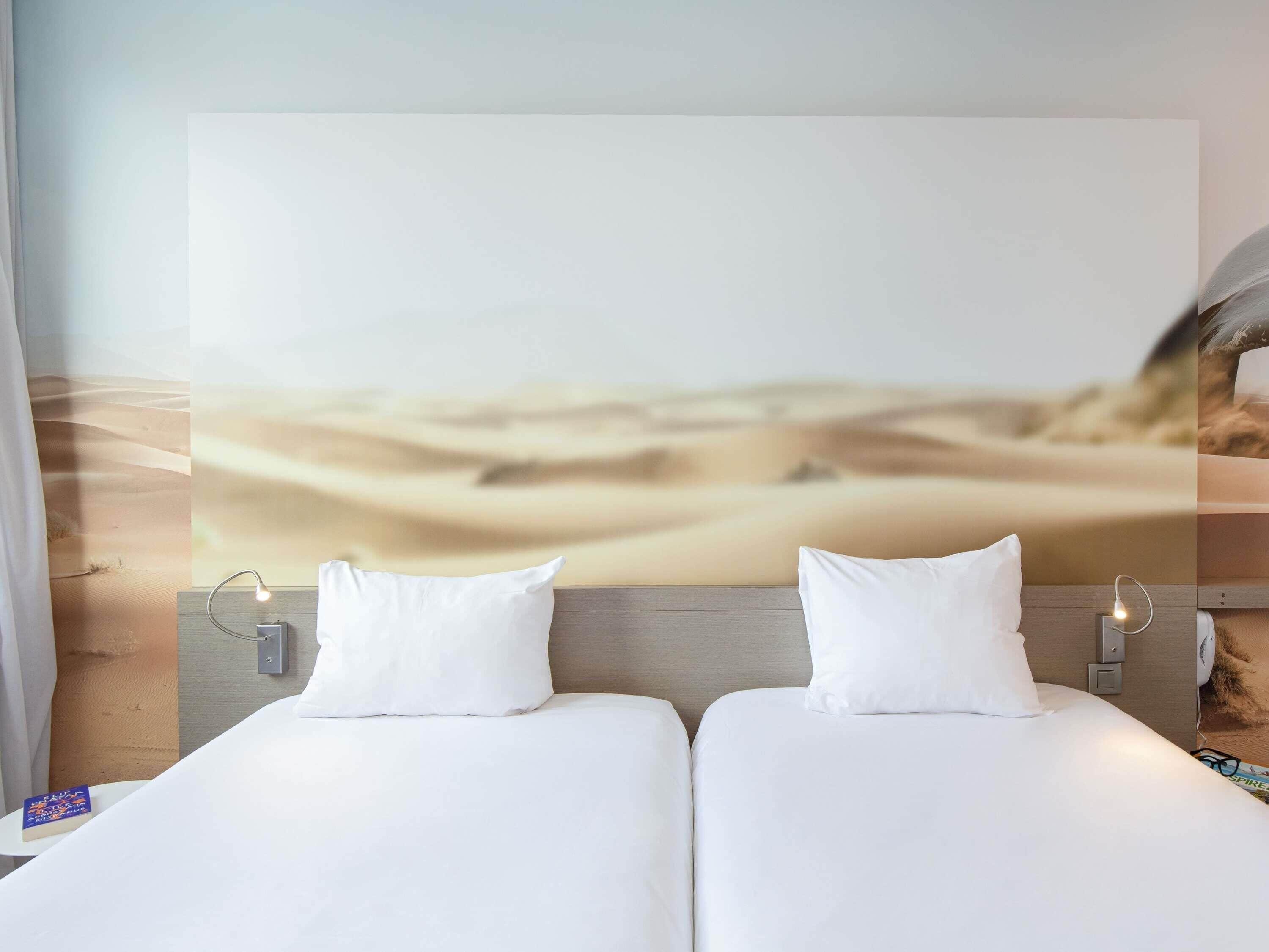 Premium bedding, pillow-top beds, desk, laptop workspace