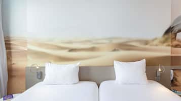 Premium bedding, pillow-top beds, desk, laptop workspace