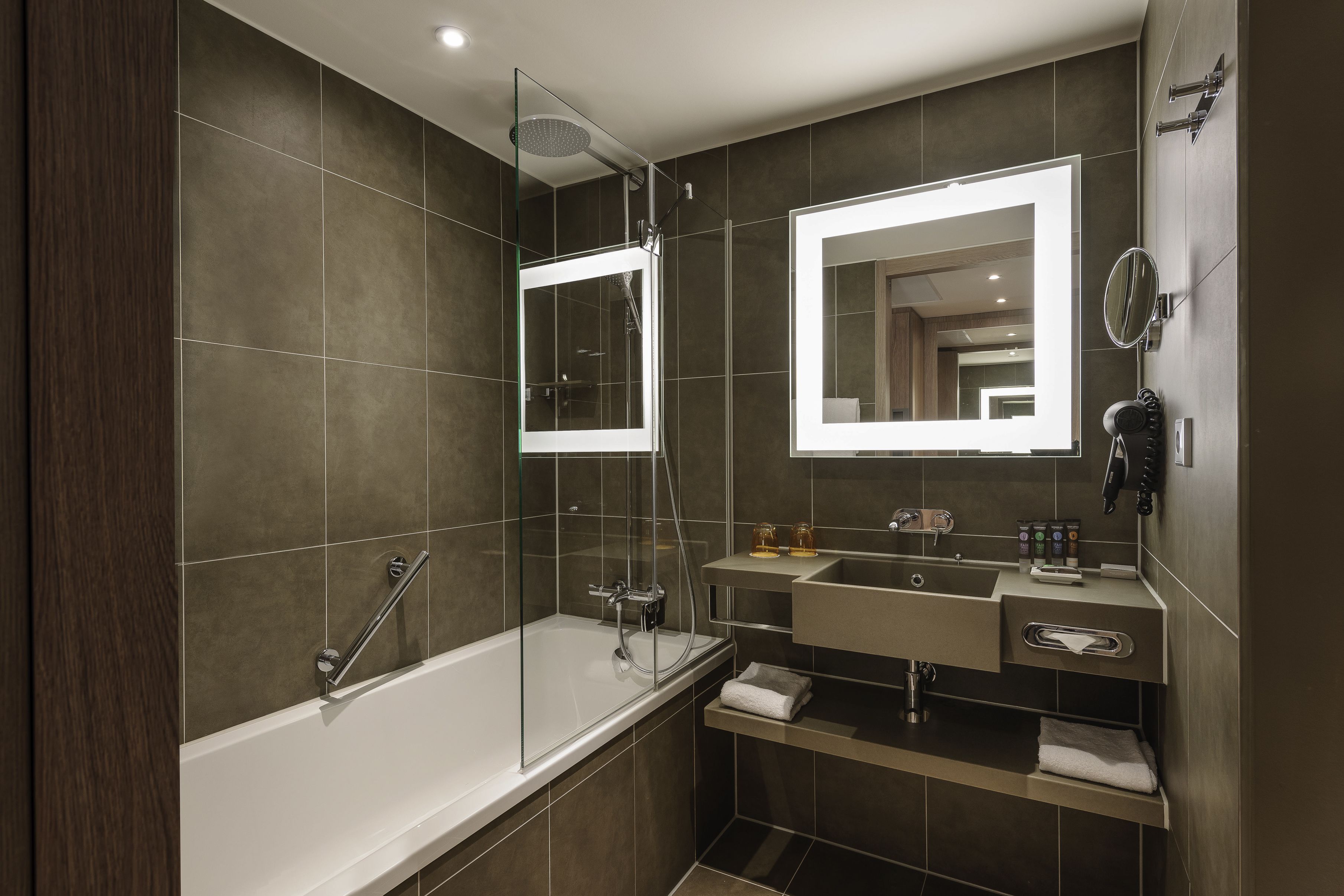 rainfall showerhead, eco-friendly toiletries, hair dryer, towels