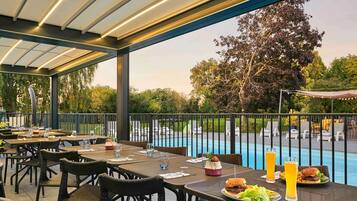 Outdoor pool, open 10:00 AM to 7:00 PM, pool loungers