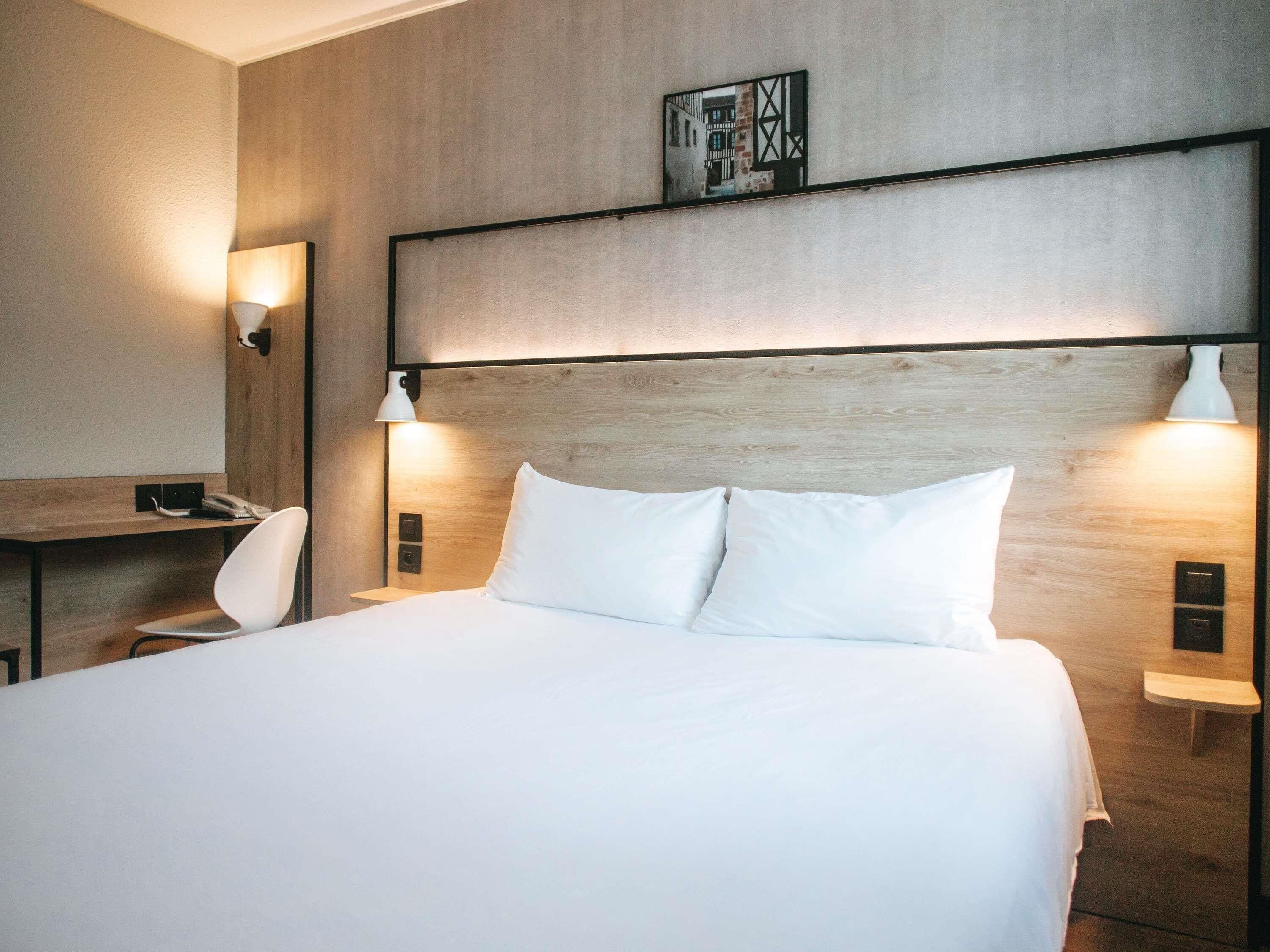 Premium bedding, desk, blackout drapes, soundproofing