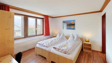 Desk, blackout drapes, bed sheets, alarm clocks