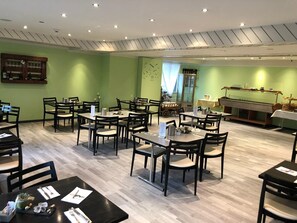 Guests can dine in comfort at this restaurant, surrounded by tables and chairs.
