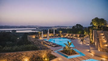 Seasonal outdoor pool, pool umbrellas, pool loungers