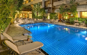 Outdoor pool, open 8:30 AM to 2:30 PM, pool umbrellas, pool loungers