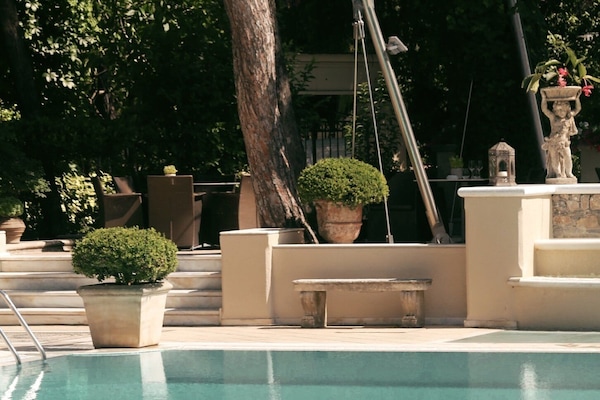 Seasonal outdoor pool, pool umbrellas, pool loungers