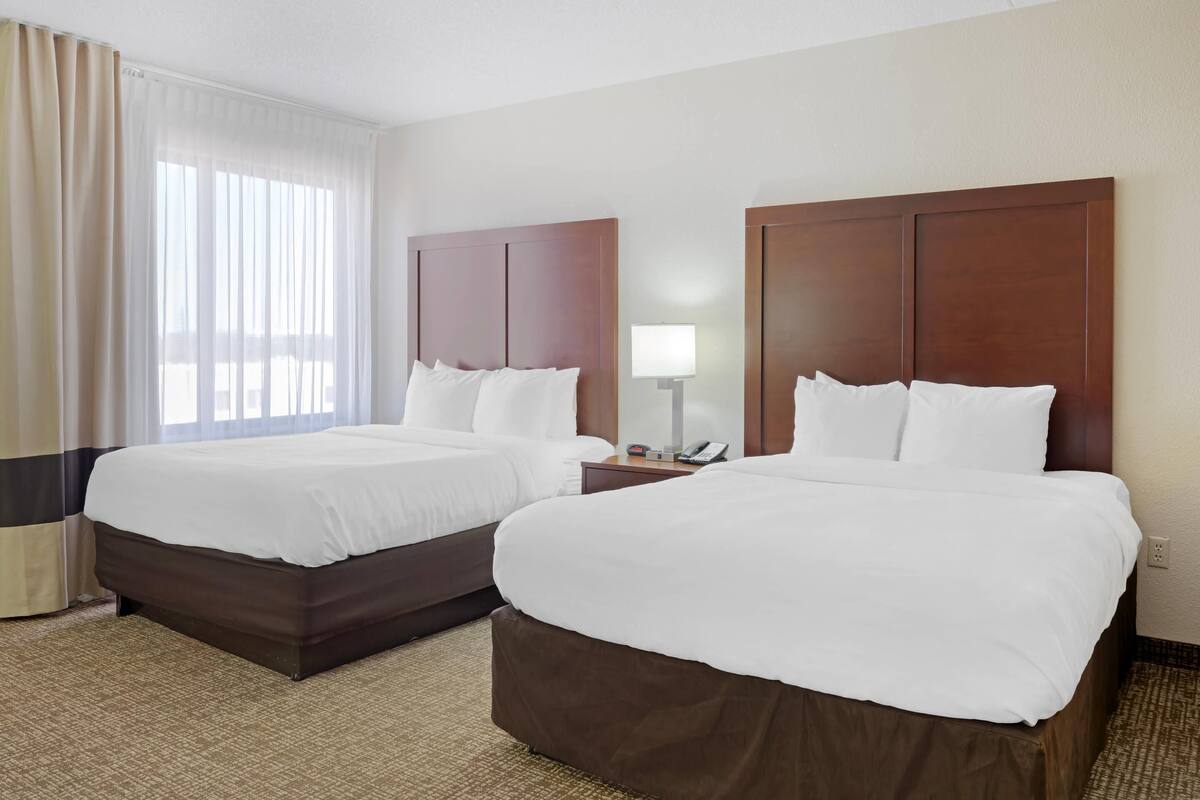 Suite, 2 Queen Beds, Non Smoking | Desk, blackout drapes, iron/ironing board, cribs (free)