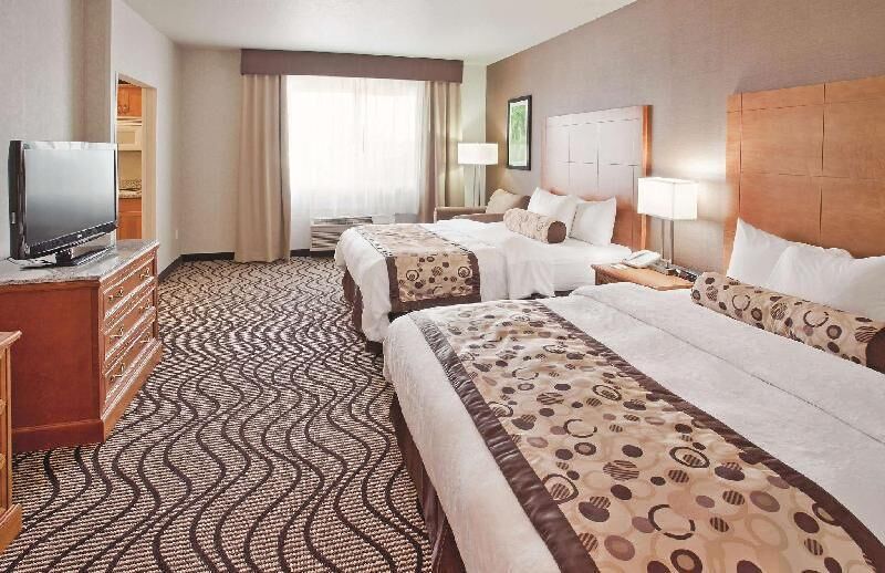 Premium bedding, desk, laptop workspace, blackout drapes