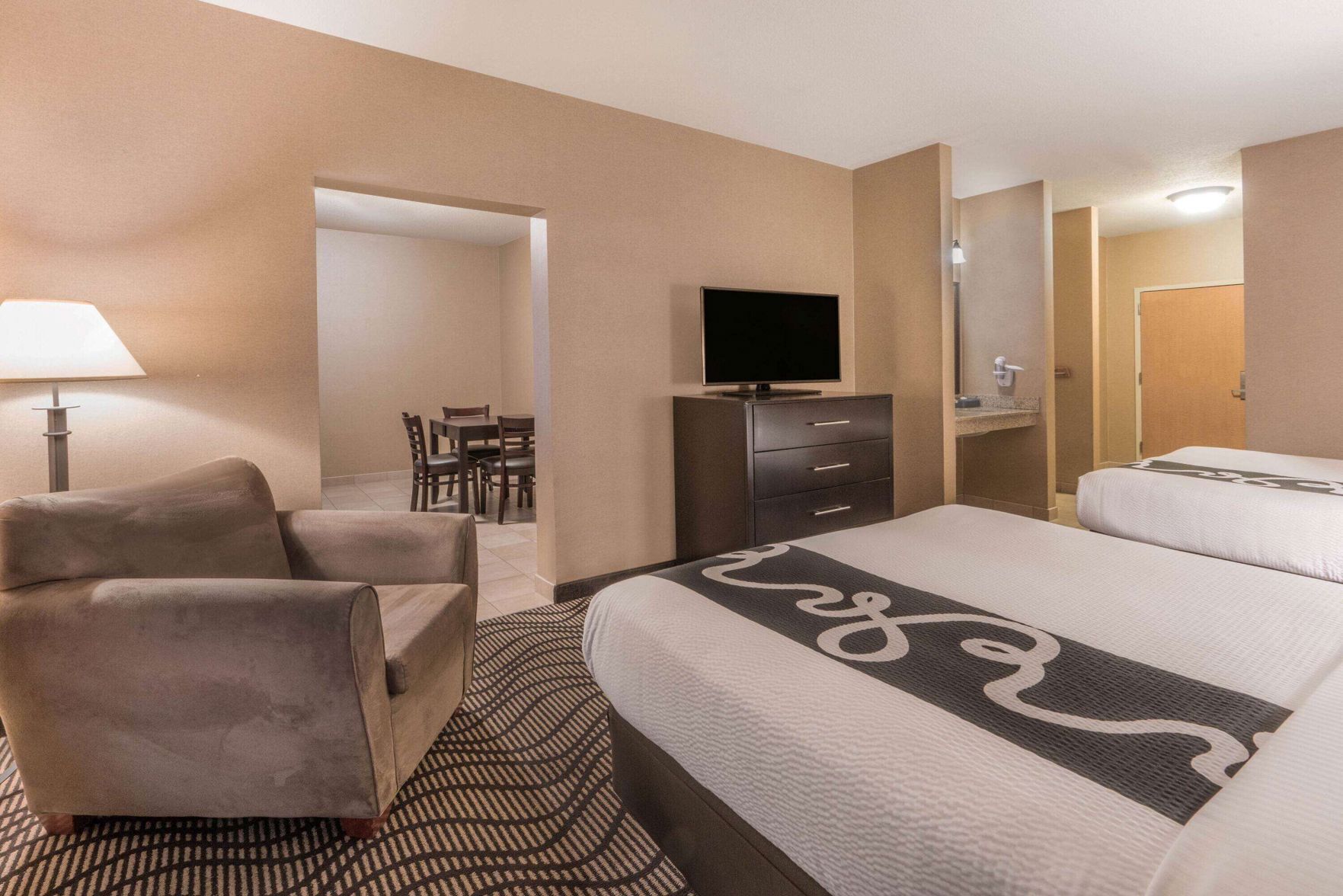 Premium bedding, desk, laptop workspace, blackout drapes