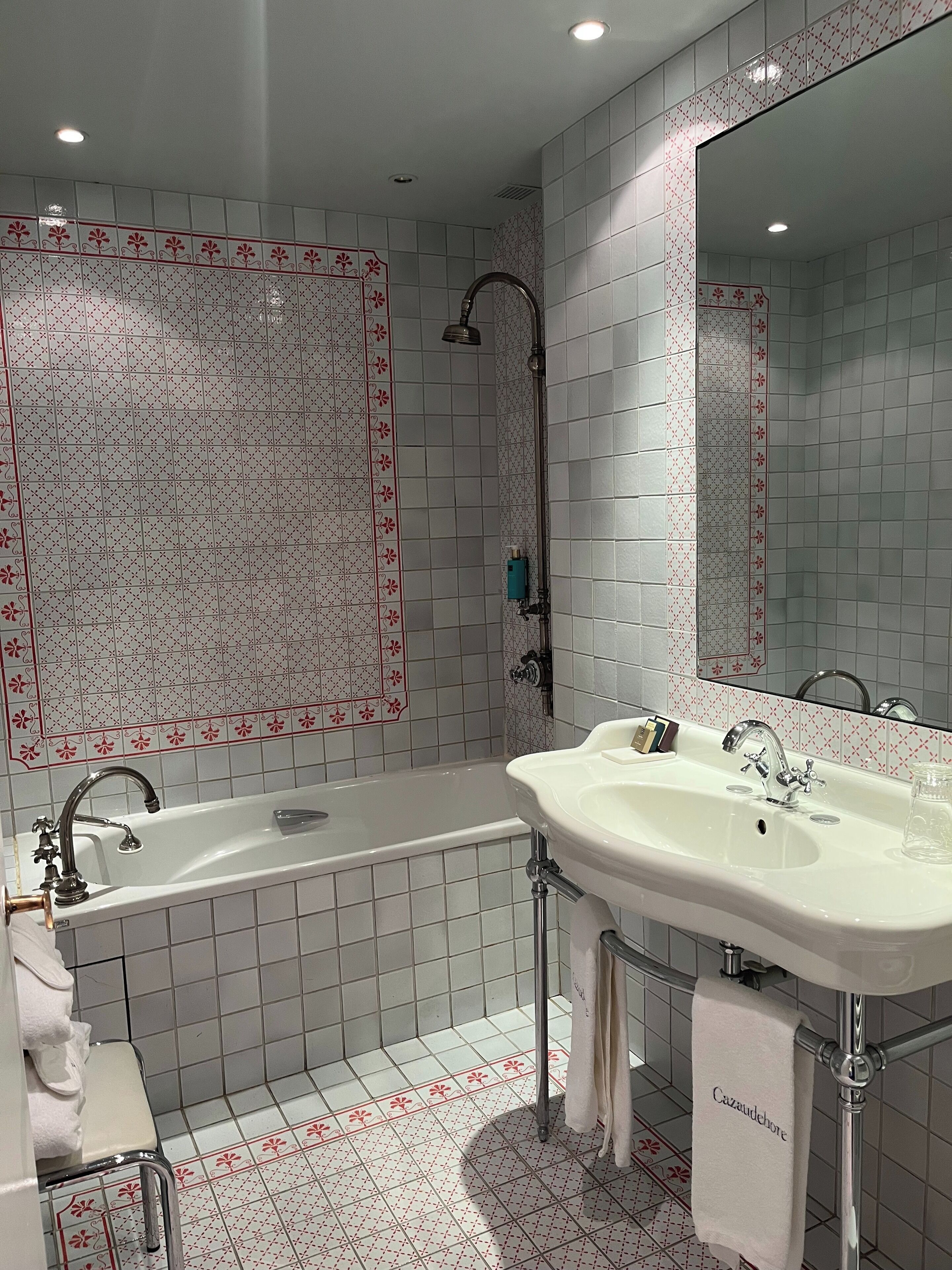 bathtub, designer toiletries, hair dryer, bathrobes