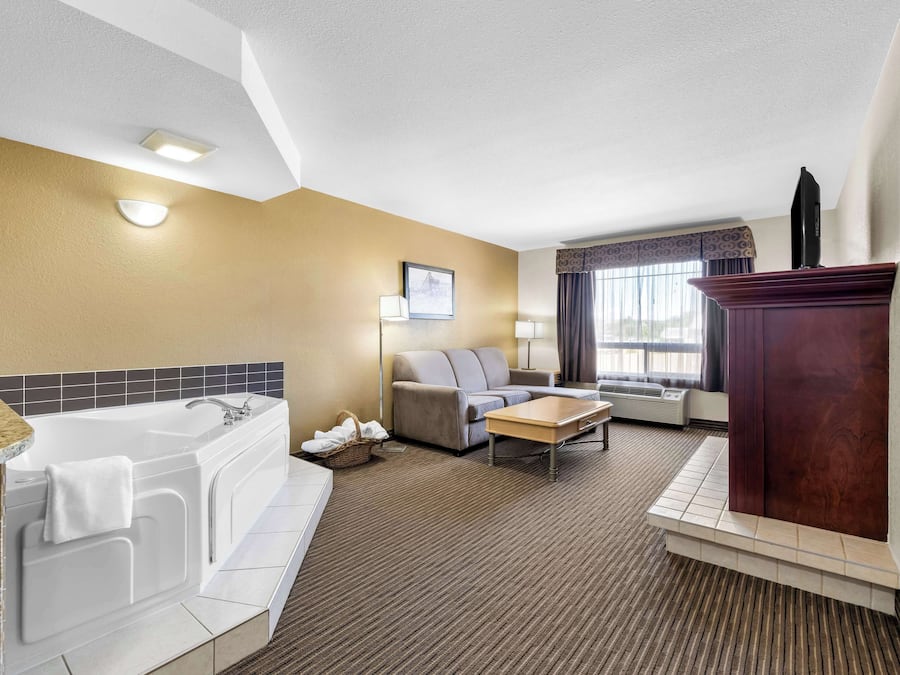 Desk, laptop workspace, blackout drapes, iron/ironing board