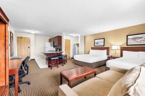 Desk, laptop workspace, blackout drapes, iron/ironing board - SureStay Plus Hotel by Best Western Drumheller (Drumheller)