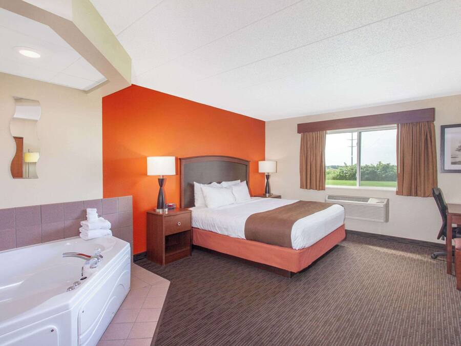 Premium bedding, pillow-top beds, desk, laptop workspace