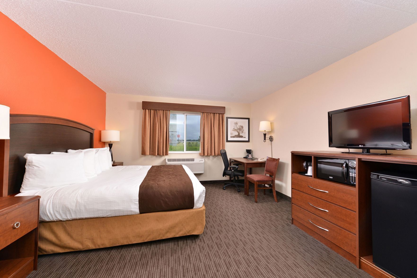 Premium bedding, pillow-top beds, desk, laptop workspace