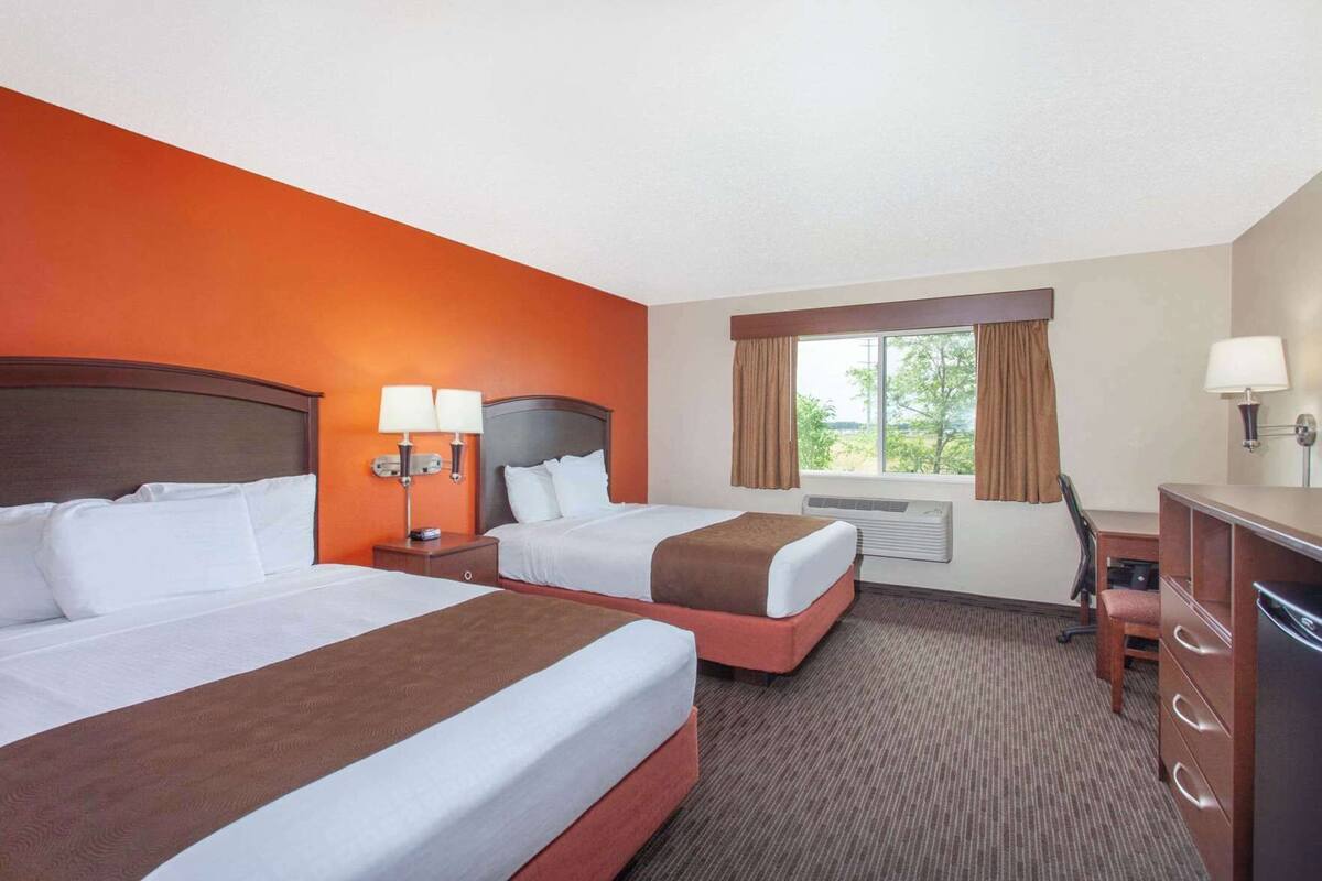 Premium bedding, pillow-top beds, desk, laptop workspace