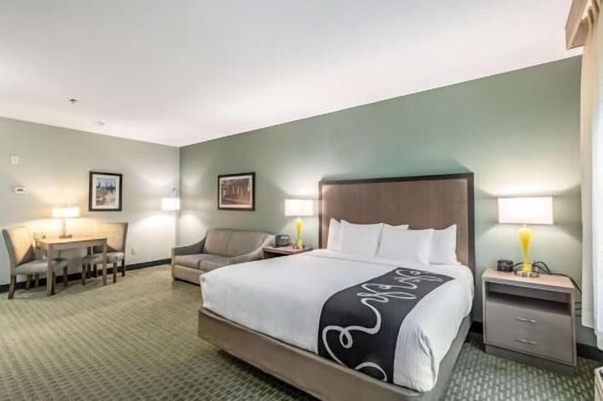 Premium bedding, laptop workspace, blackout drapes, iron/ironing board