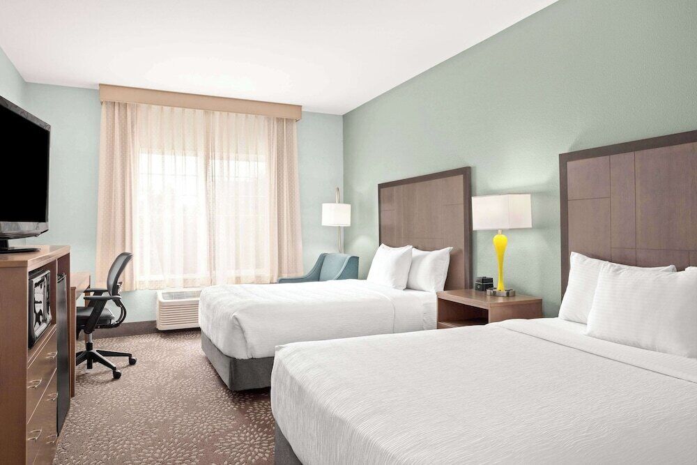 Premium bedding, laptop workspace, blackout drapes, iron/ironing board