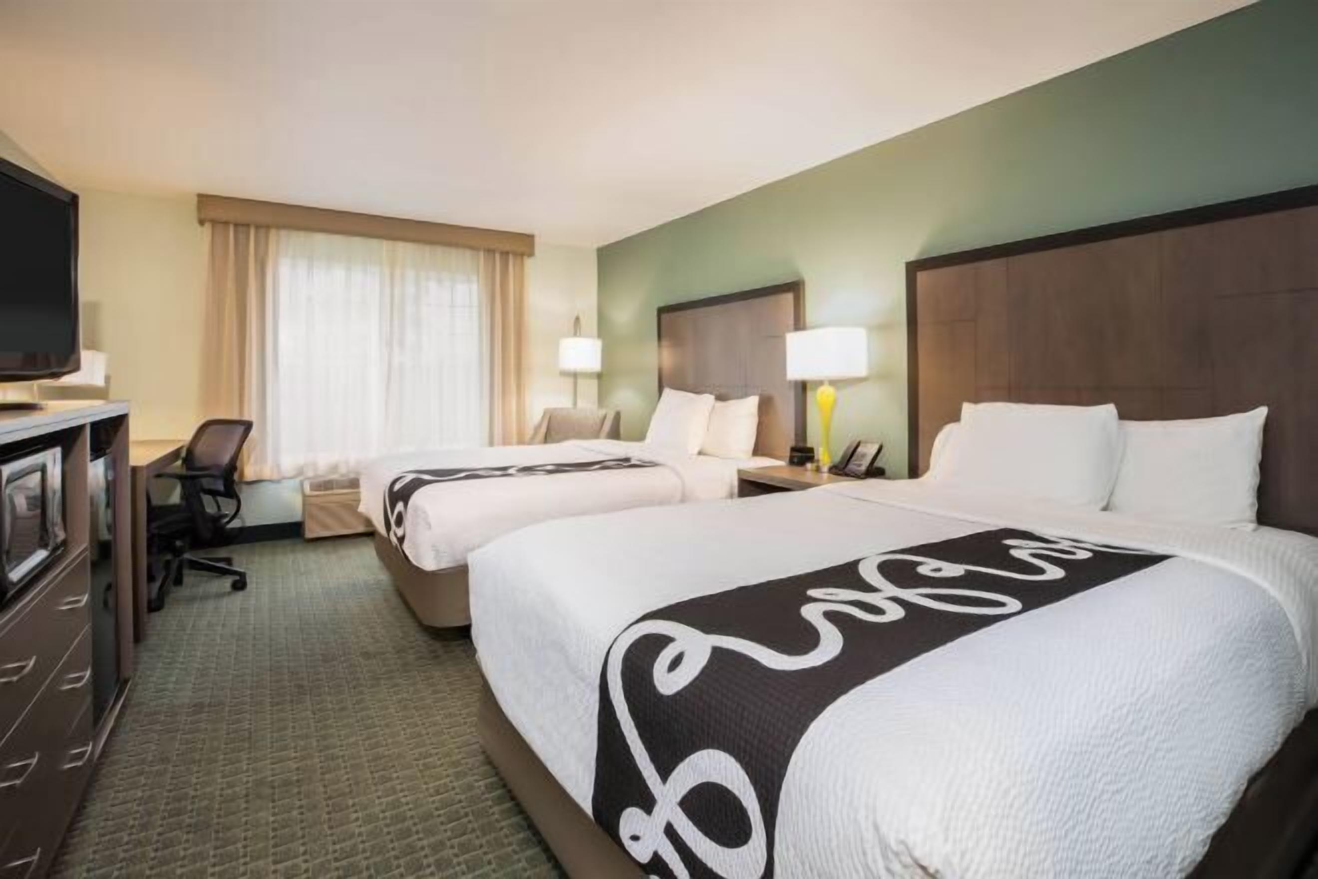 Premium bedding, laptop workspace, blackout drapes, iron/ironing board