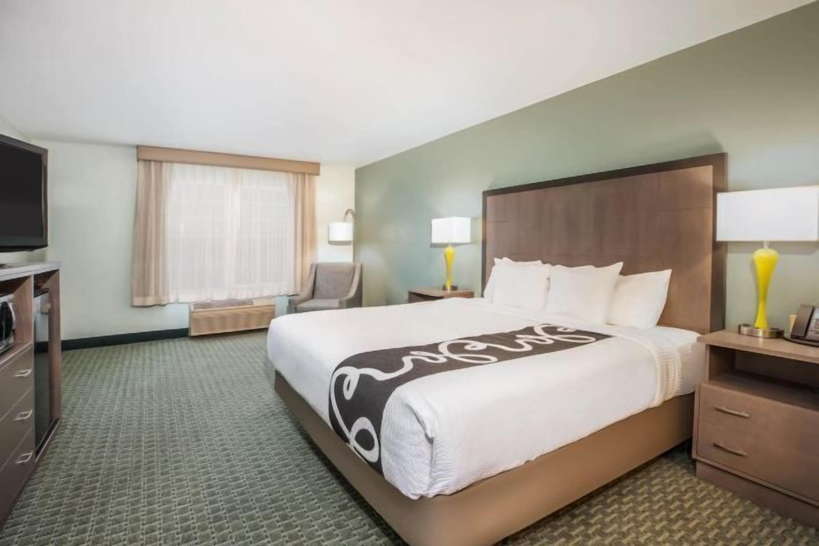 Premium bedding, laptop workspace, blackout drapes, iron/ironing board