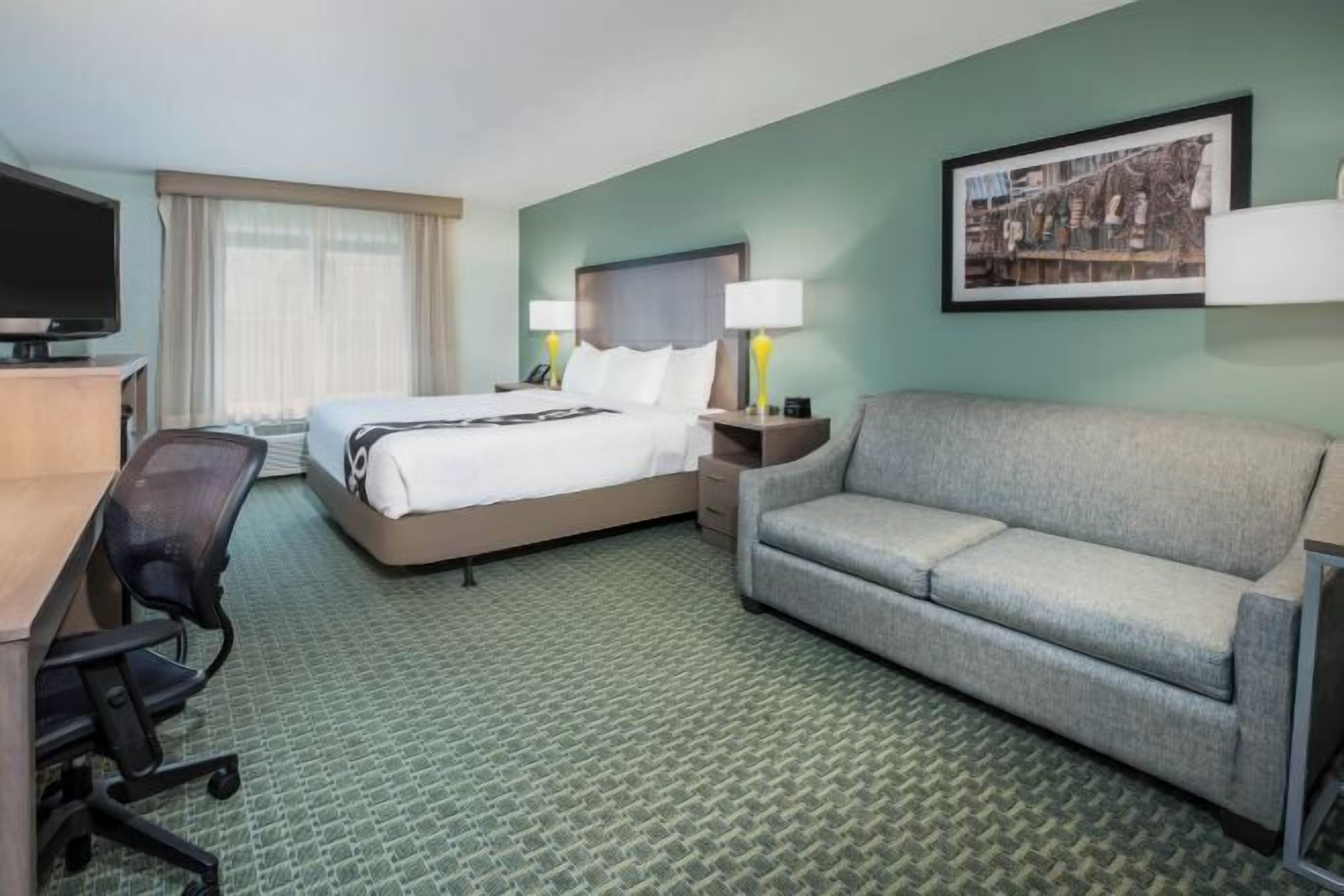 Premium bedding, laptop workspace, blackout drapes, iron/ironing board