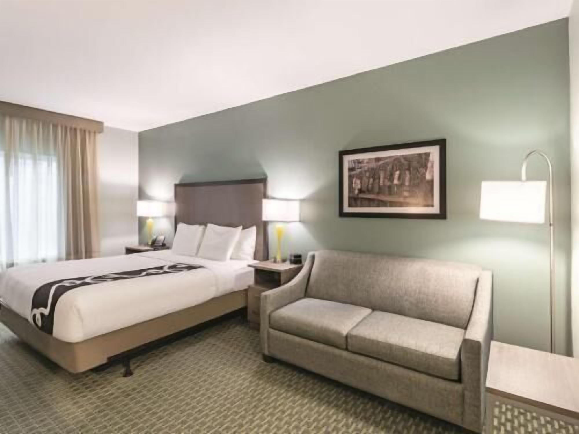 Premium bedding, laptop workspace, blackout drapes, iron/ironing board