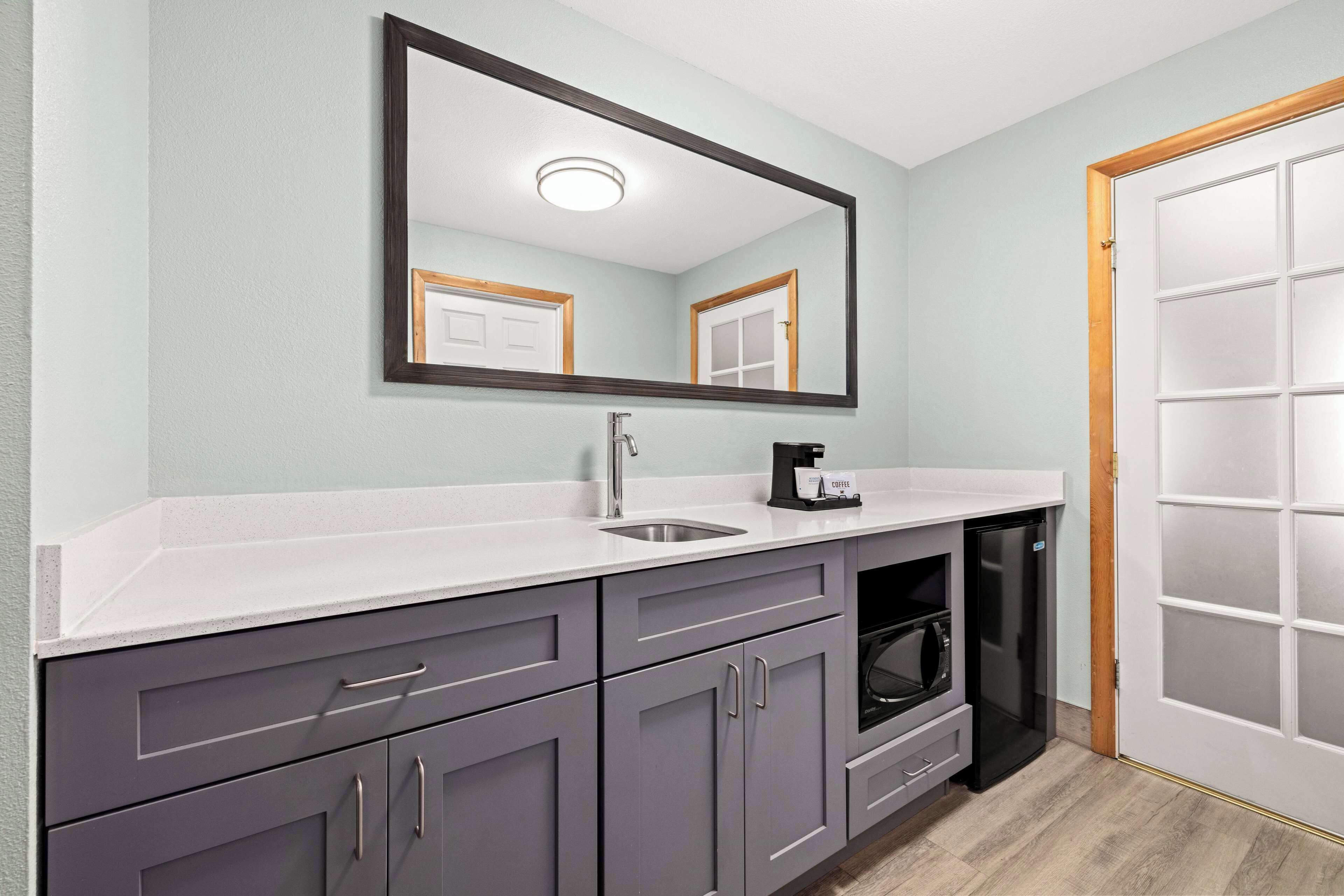 suite, 1 king bed, non smoking | premium bedding, laptop workspace, blackout curtains, iron/ironing board