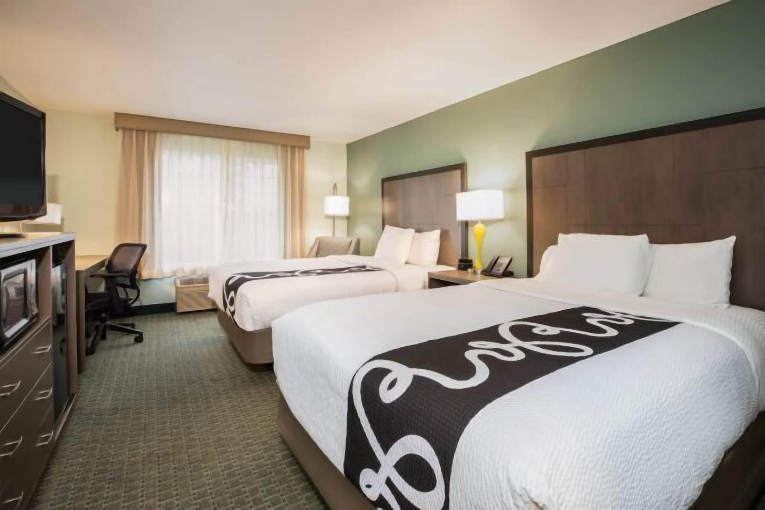 Premium bedding, laptop workspace, blackout drapes, iron/ironing board