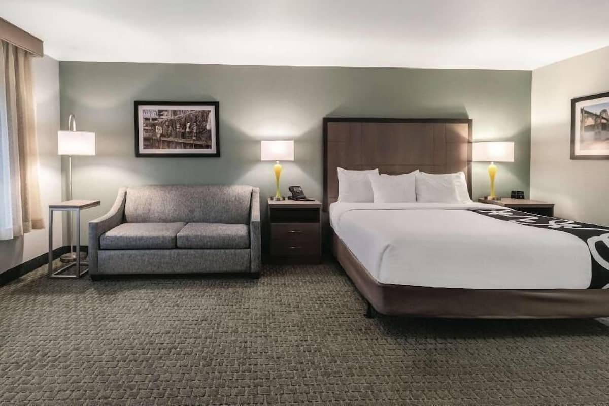 Premium bedding, laptop workspace, blackout drapes, iron/ironing board