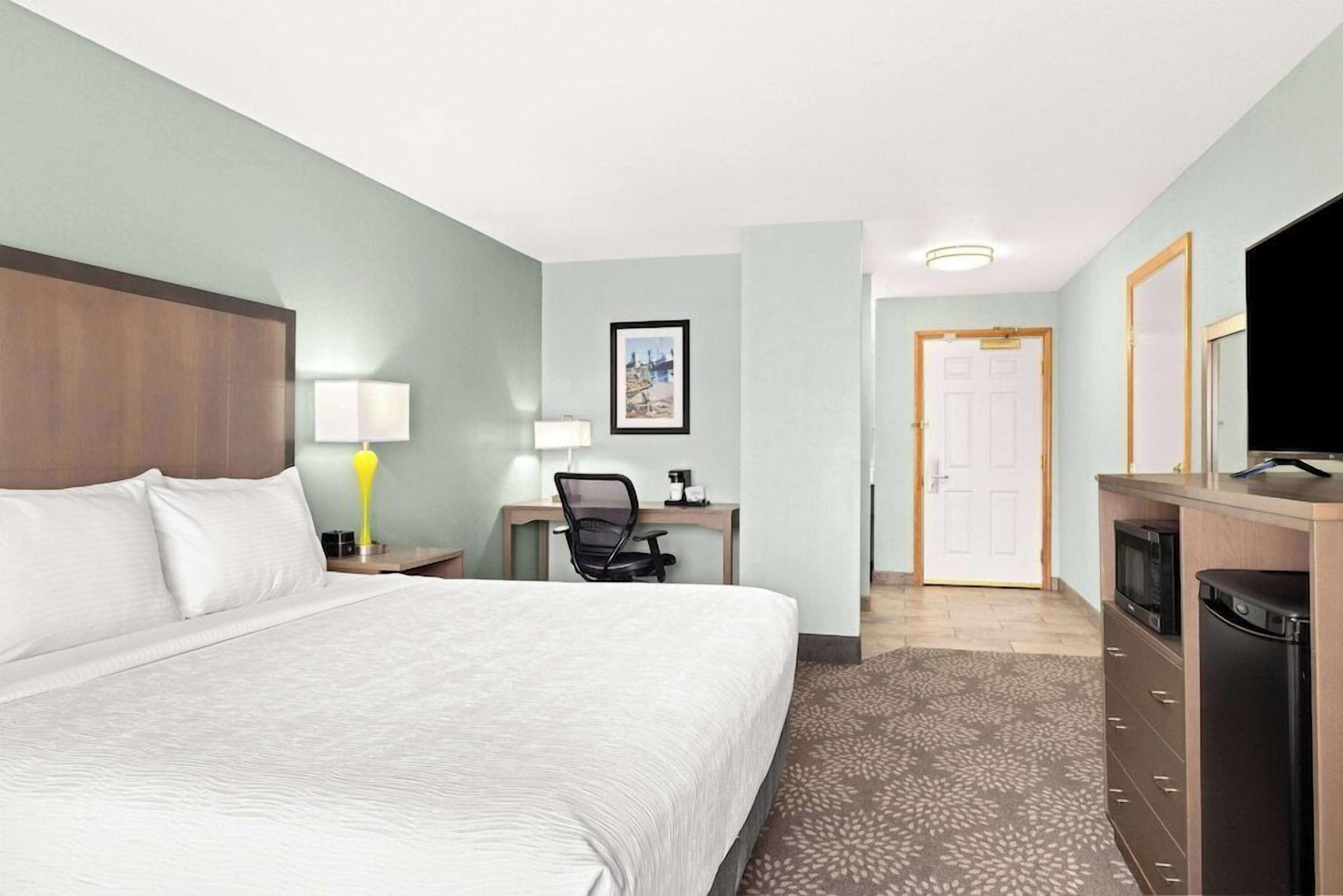 Premium bedding, laptop workspace, blackout drapes, iron/ironing board