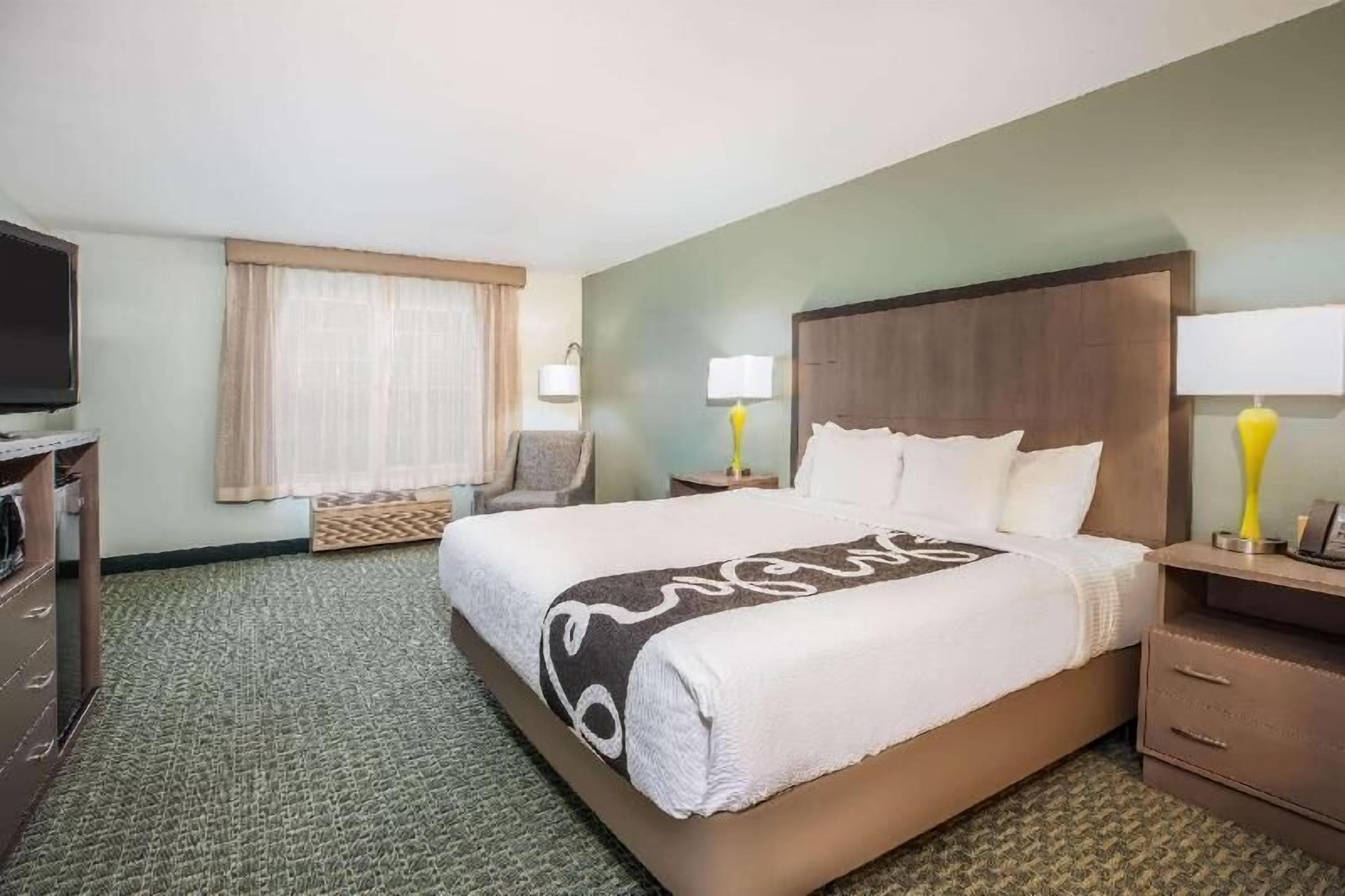 Premium bedding, laptop workspace, blackout drapes, iron/ironing board