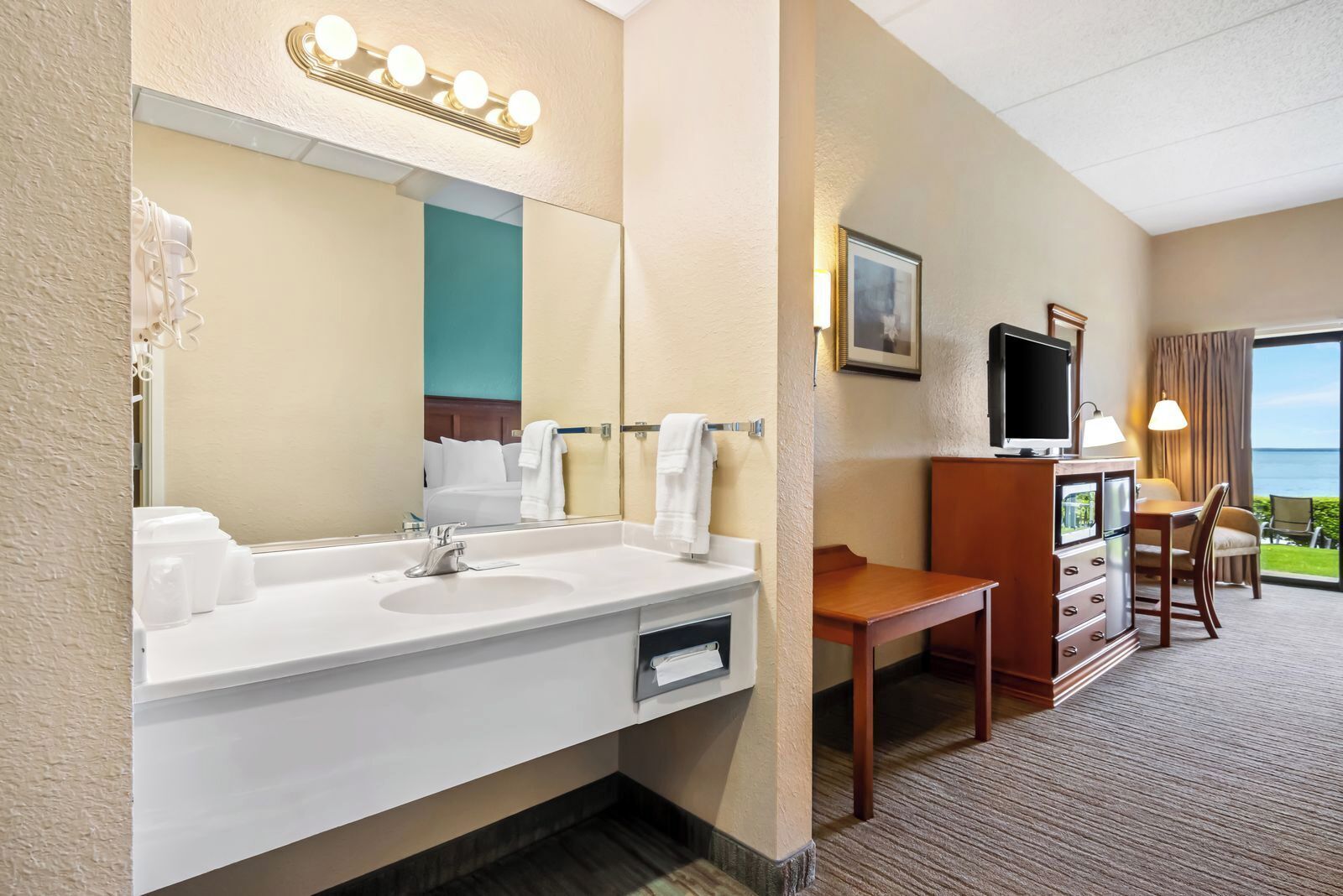 king bed handicap lakefront balcony | in-room safe, desk, iron/ironing board, free wifi