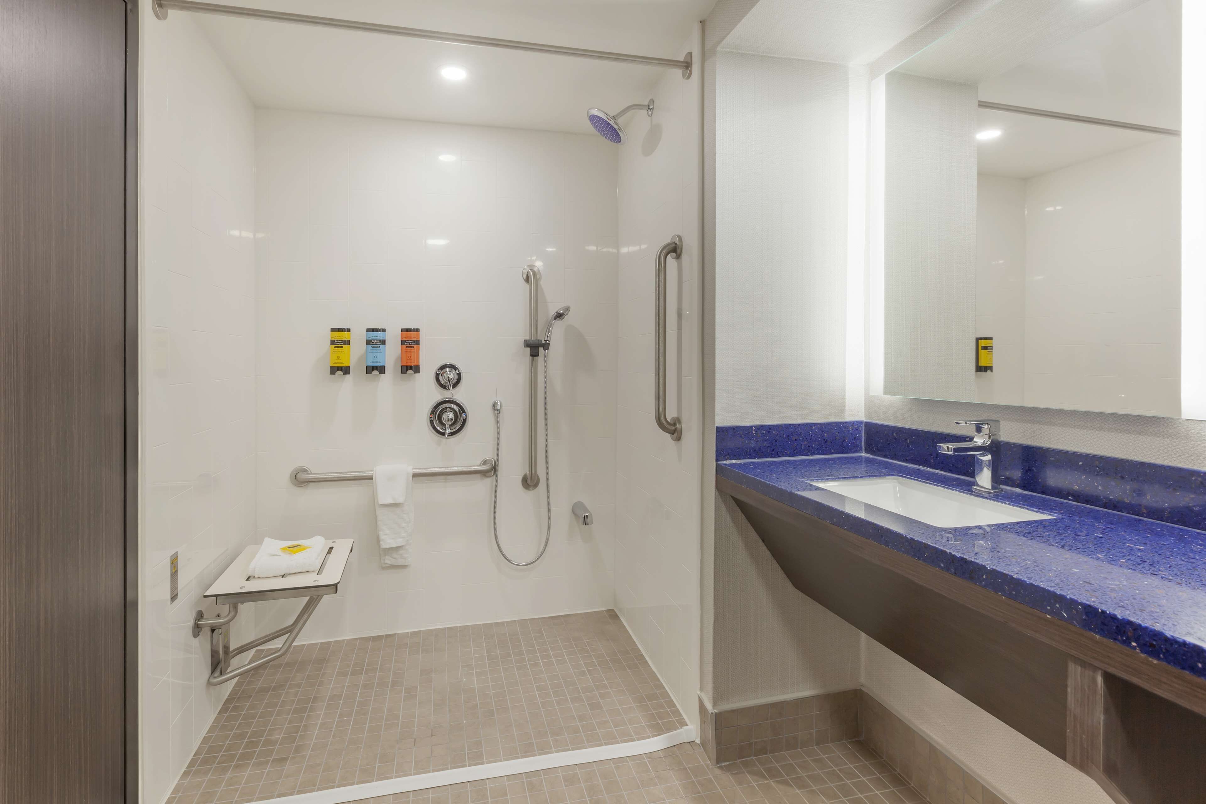 standard room, 2 queen beds, accessible, refrigerator & microwave | bathroom | shower, hair dryer, towels